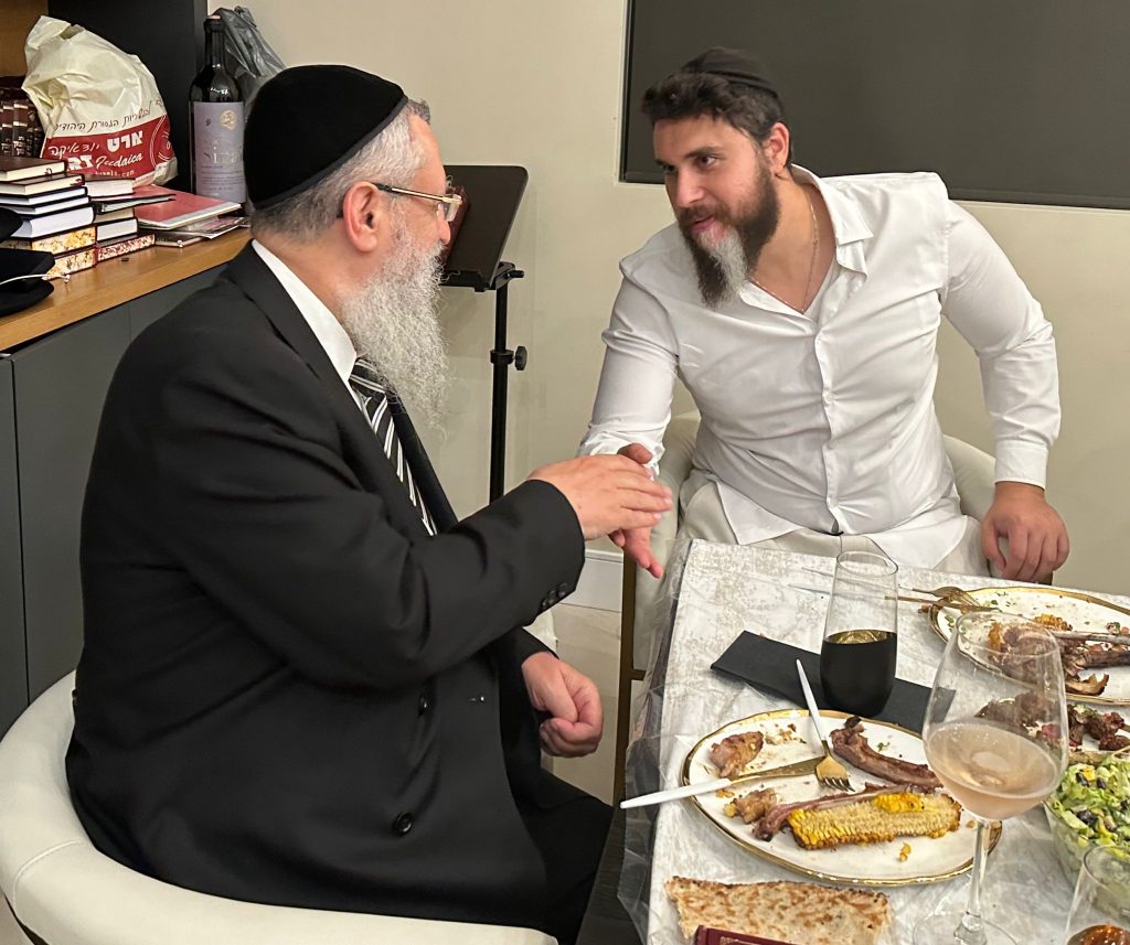 Shalev Haziza helping Rabbi David Yosef